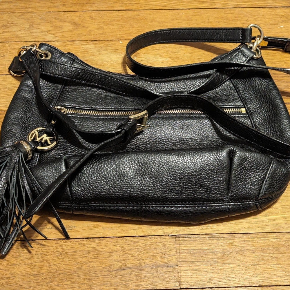 Authentic Michael Kors black cross body bag in black leather and gold hardware